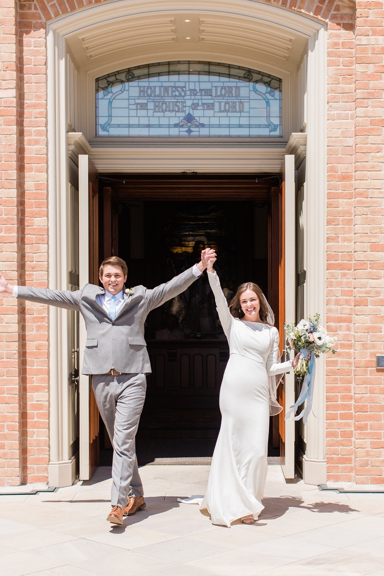 Wedding exit photo at the Provo City Center Temple. Whitney Hunt Photography.