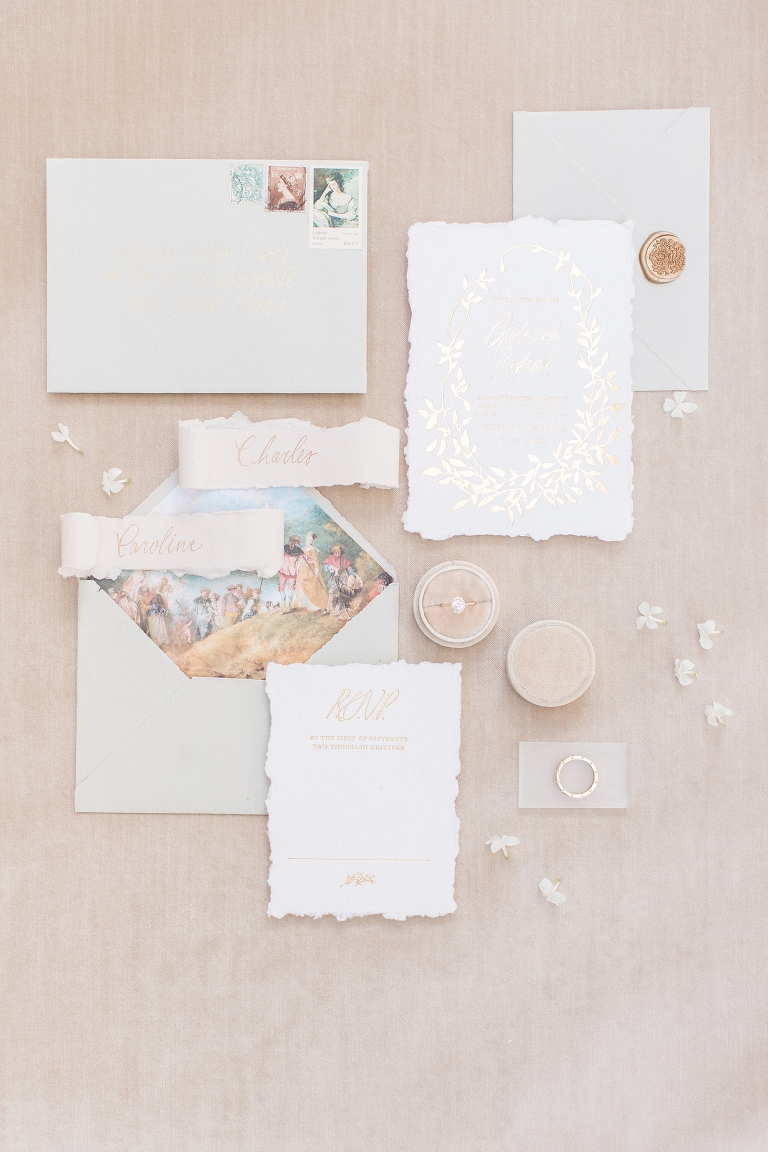 Wedding invitation suite flat lay at the Grand America Hotel.