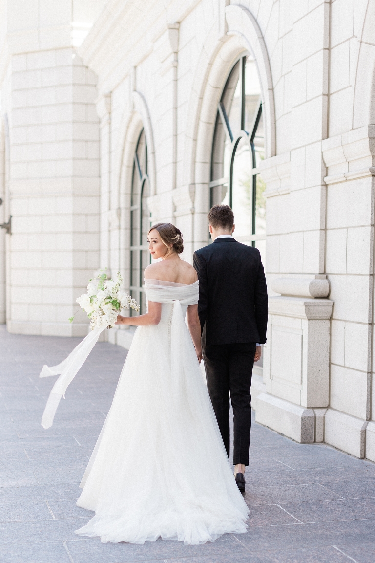 Photo of bride and groom on their wedding day at the Grand America Hotel.