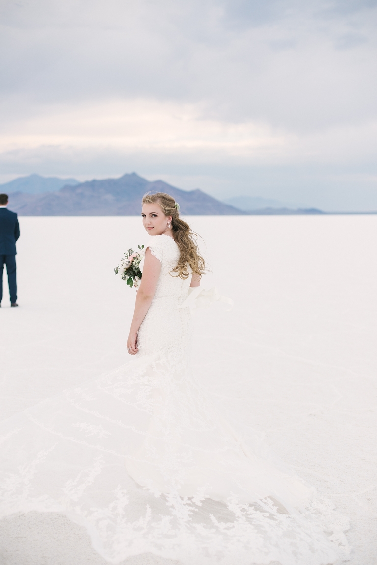 Photo of Bride's first look out on the Utah Salt Flats. Whitney Hunt Photography