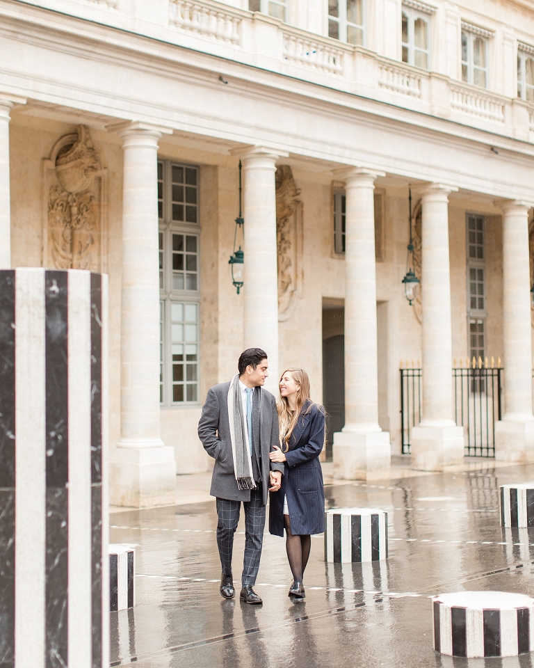 Paris elopement location ideas. Palais Royal engagement session photo in the rain.